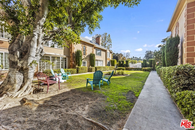 view of property's community with a lawn