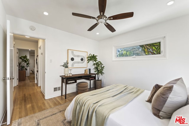 bedroom featuring ceiling fan and hardwood / wood-style flooring