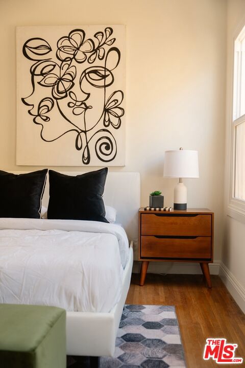 bedroom featuring wood-type flooring