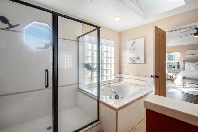 bathroom featuring tile patterned flooring, ceiling fan, plus walk in shower, and vanity