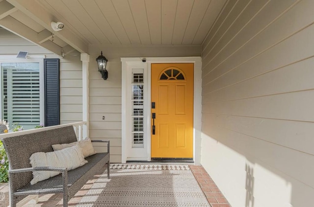 doorway to property featuring covered porch