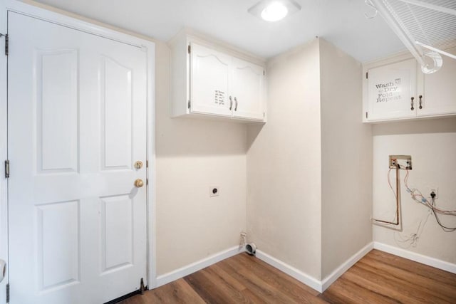 laundry area featuring electric dryer hookup, hardwood / wood-style floors, hookup for a washing machine, and cabinets