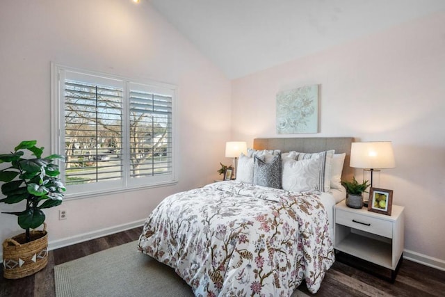 bedroom featuring vaulted ceiling and dark hardwood / wood-style flooring