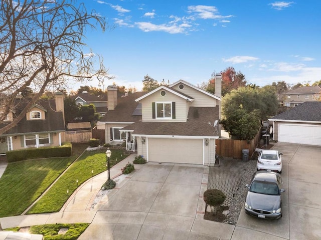 front of property with a front yard and a garage