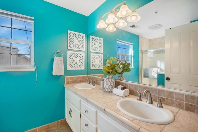 bathroom with vanity, tile patterned flooring, and a shower with shower door