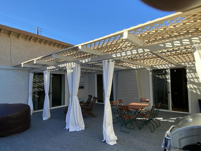 view of patio featuring grilling area and a pergola