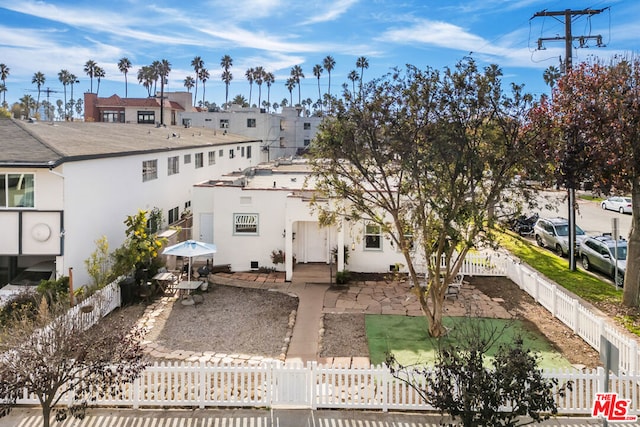 rear view of property featuring a patio