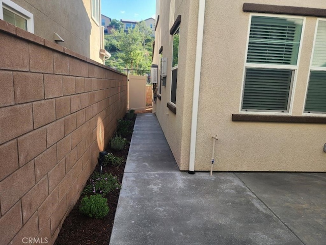 view of side of home featuring a patio area