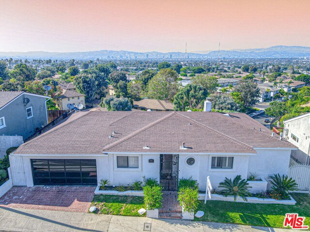 view of front of house with a mountain view and a garage