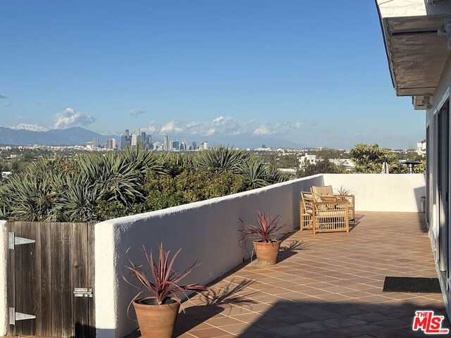 balcony featuring a mountain view