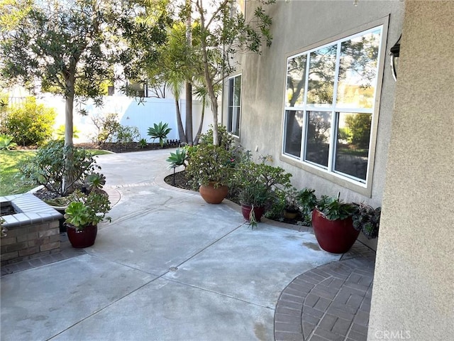 view of patio featuring fence