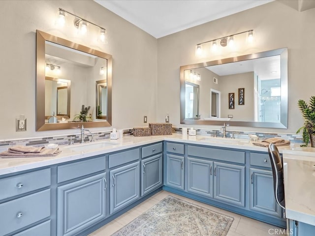 bathroom featuring double vanity and a sink