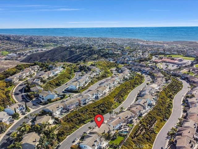 birds eye view of property featuring a water view and a residential view