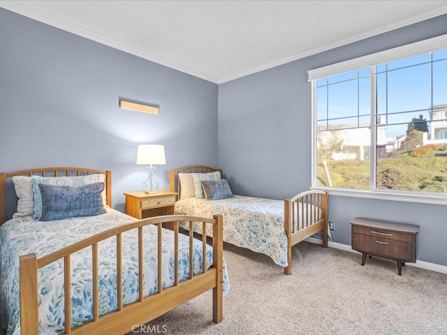 carpeted bedroom featuring baseboards and ornamental molding