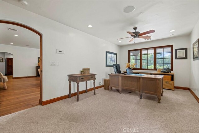 office featuring light carpet and ceiling fan