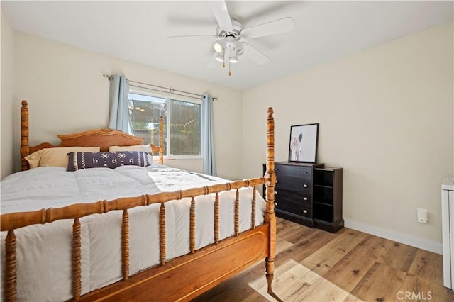 bedroom featuring light wood-type flooring and ceiling fan