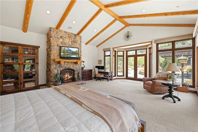 bedroom with carpet floors, beamed ceiling, french doors, a fireplace, and high vaulted ceiling