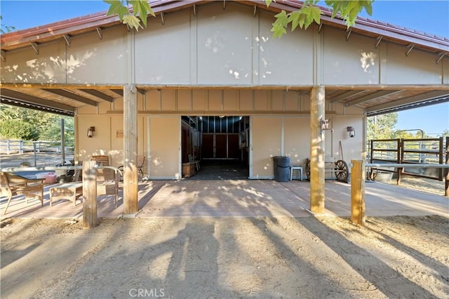 view of property exterior with an outbuilding