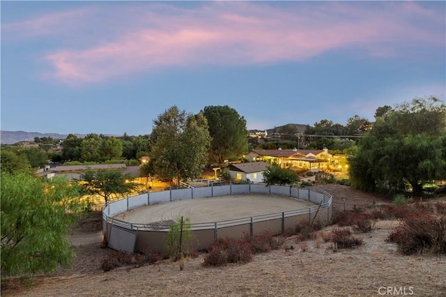 view of tennis court with a mountain view