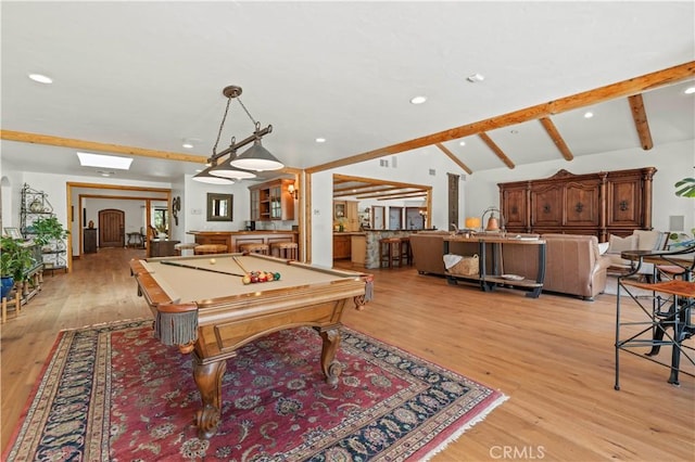 game room featuring billiards, lofted ceiling with beams, and light hardwood / wood-style flooring