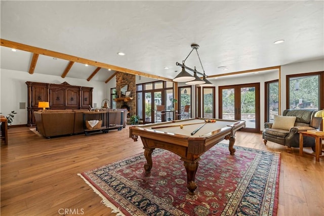 recreation room featuring billiards, french doors, a wealth of natural light, and light hardwood / wood-style floors