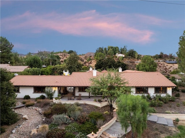 view of front of home with a patio area