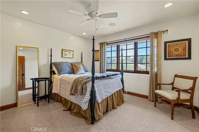 bedroom with ceiling fan and light colored carpet