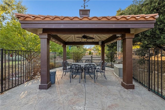 view of patio / terrace with ceiling fan and a gazebo