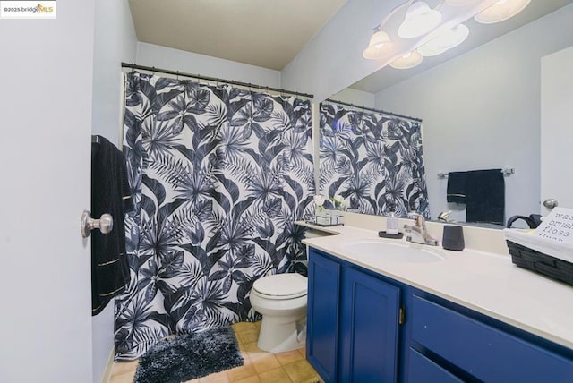 bathroom featuring toilet and vanity