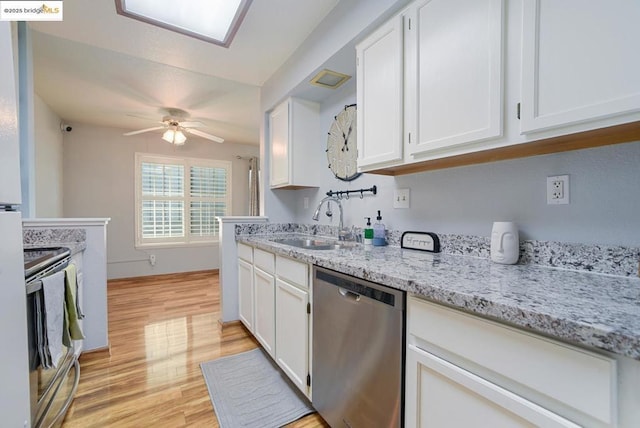 kitchen with white cabinets, stainless steel appliances, and sink