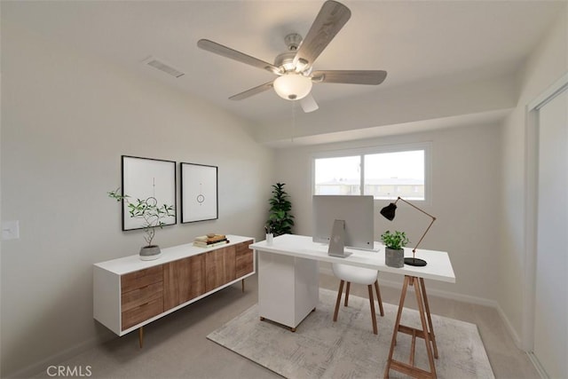 carpeted home office with ceiling fan