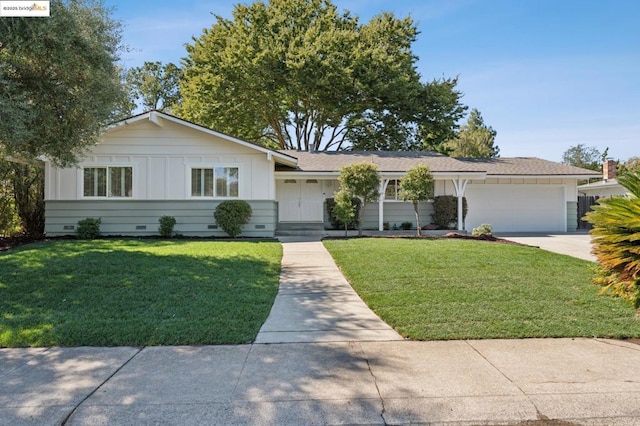 ranch-style house with a front lawn and a garage