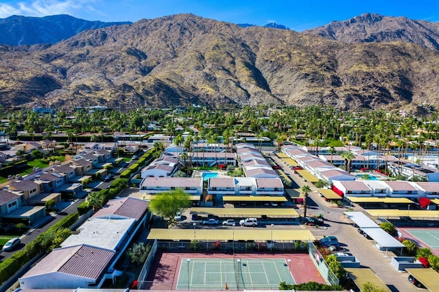 birds eye view of property with a mountain view