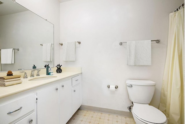 bathroom with toilet and vanity