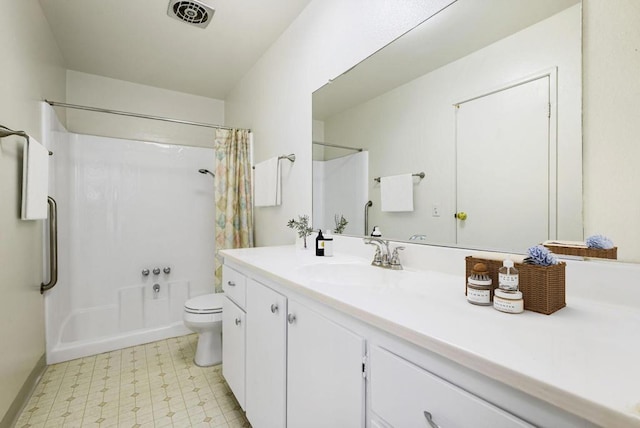 bathroom with toilet and vanity