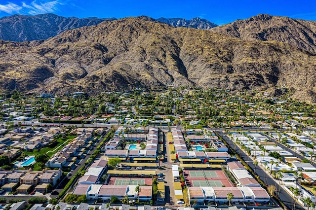 birds eye view of property with a mountain view