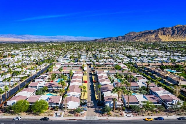 birds eye view of property with a mountain view