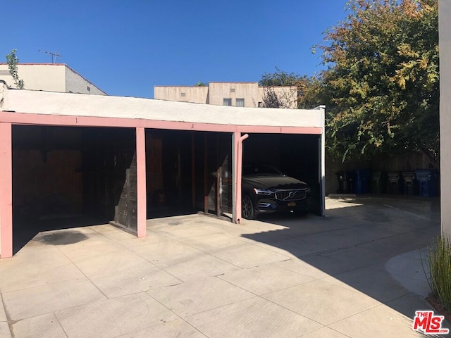 garage featuring a carport