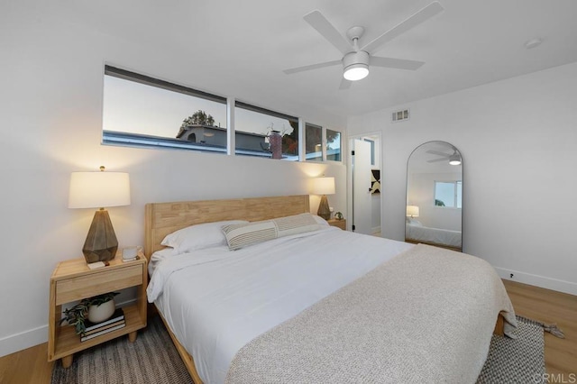 bedroom featuring ceiling fan and wood-type flooring