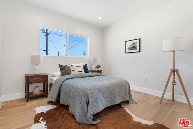 bedroom with wood-type flooring