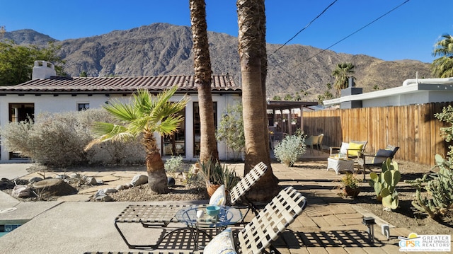 view of patio / terrace with a mountain view