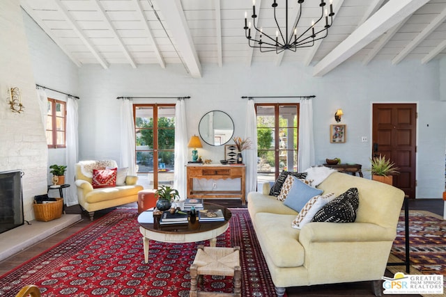 living room featuring an inviting chandelier, hardwood / wood-style flooring, and lofted ceiling with beams