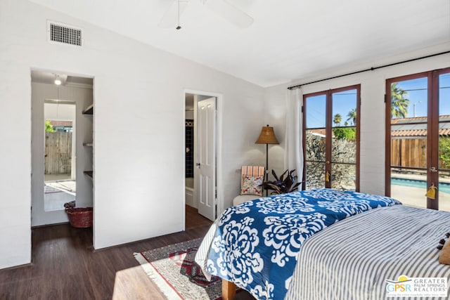 bedroom with lofted ceiling, ceiling fan, access to exterior, dark hardwood / wood-style floors, and ensuite bath