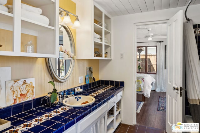 bathroom with ceiling fan, vanity, and wooden ceiling