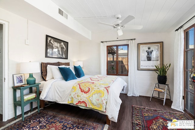 bedroom with ceiling fan, dark hardwood / wood-style flooring, and wood ceiling