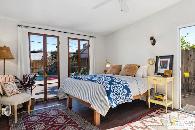 bedroom featuring ceiling fan, hardwood / wood-style flooring, access to outside, and multiple windows