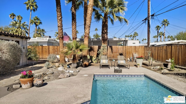 view of swimming pool featuring a patio