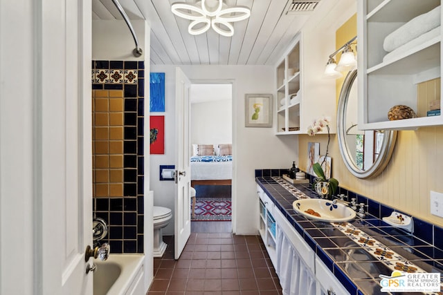 full bathroom with toilet, vanity, tile patterned floors, washtub / shower combination, and wooden ceiling