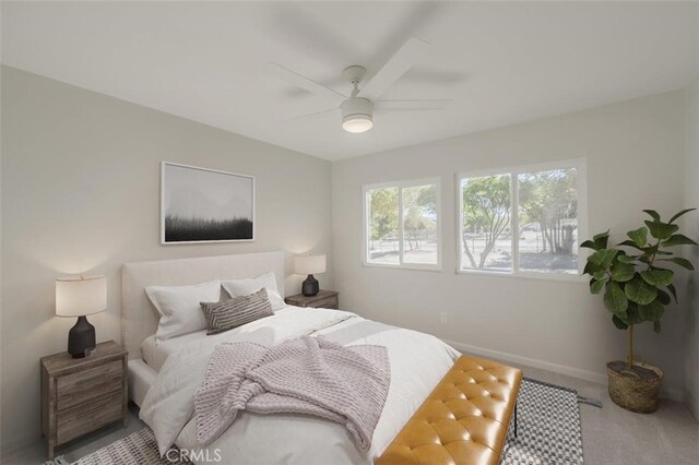 bedroom with ceiling fan and carpet