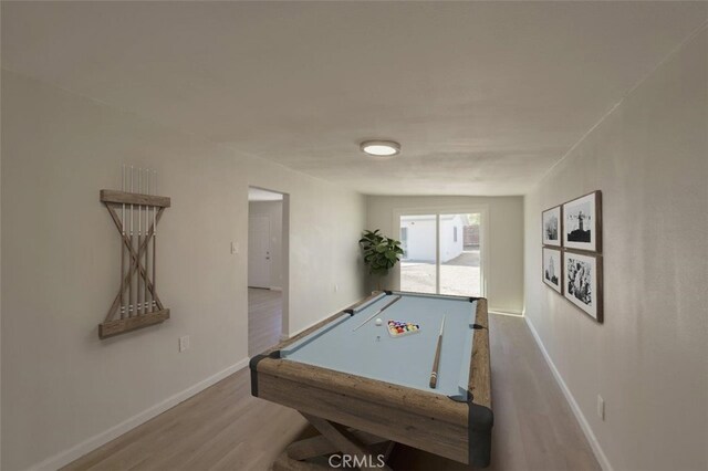 playroom with light hardwood / wood-style floors and pool table